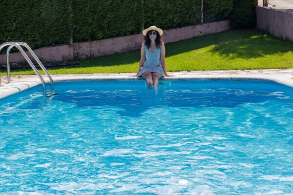 Woman sitting on a pool