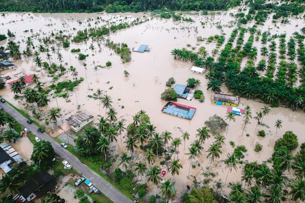 What Disaster is Not Covered by Insurance? 1 Drone shot capturing extensive flooding in Kijal, Malaysia village.